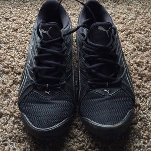 Puma black and silver tennis shoes.